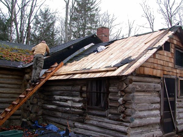 Most shingles removed from one side of the kitchen roof.