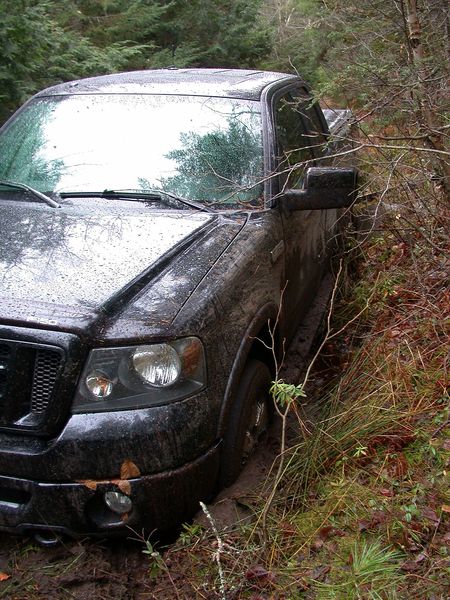 Front end of Ted's truck buried in the mud.