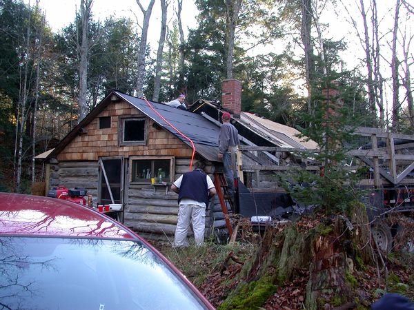 Shingling the other side of the kitchen roof.