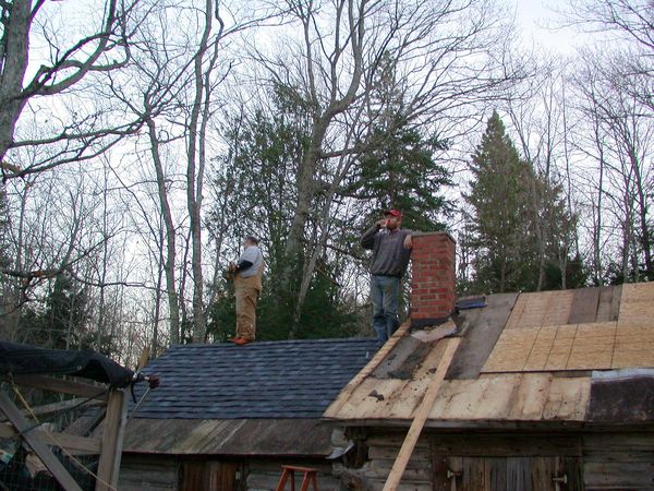 Jon and Bill enjoying a beer on the completed kitchen roof.