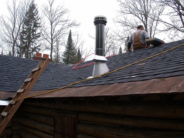 Half of the bunk room roof shingled.