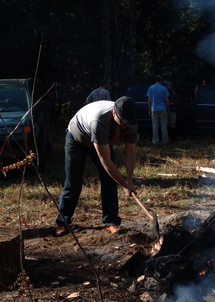 Bill chipping away at the stump.