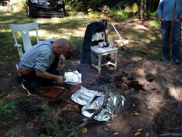 Ribs being put into the smoker.