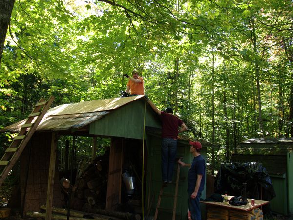 Continuing work on the wood shed roof.