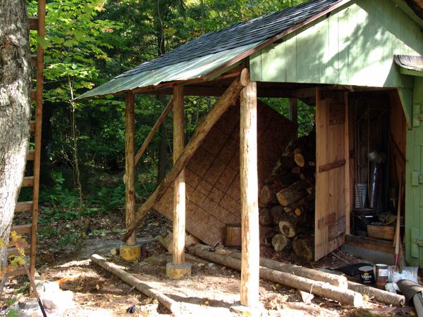 Cross supports on the wood shed.