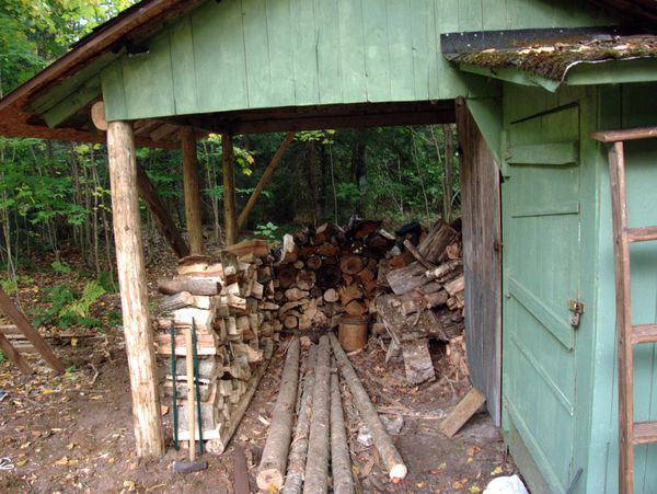 Finished wood shed with some of the wood restacked.