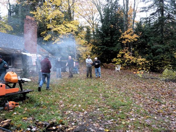 Trying to light the fire with bottle rockets.