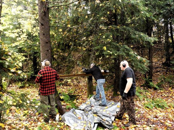 Doug, Gary, and Ted and the shooting range near the Cabin.