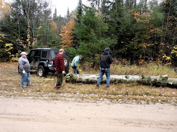 Hauling fallen tree back to the Cabin.