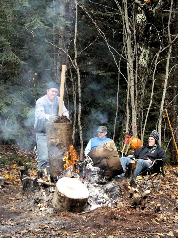 Bill setting up a chimney for the fire.