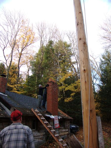 Removing bricks from the chimney.