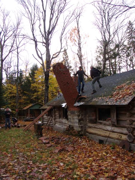 TIMBER! The chimney comes down.