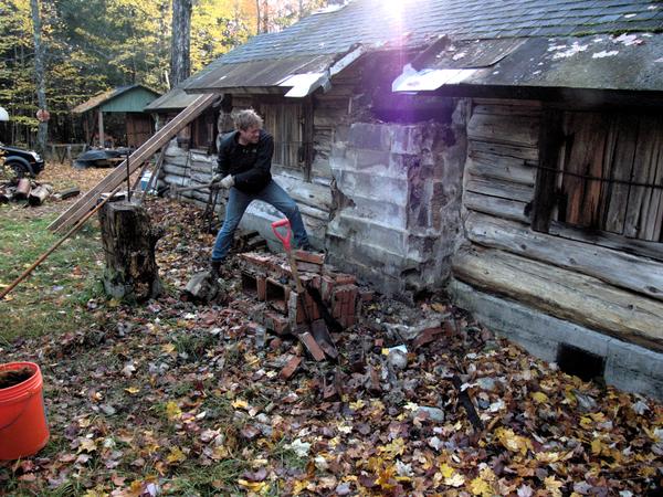 Bill working on demolishing the rest of the chimney.