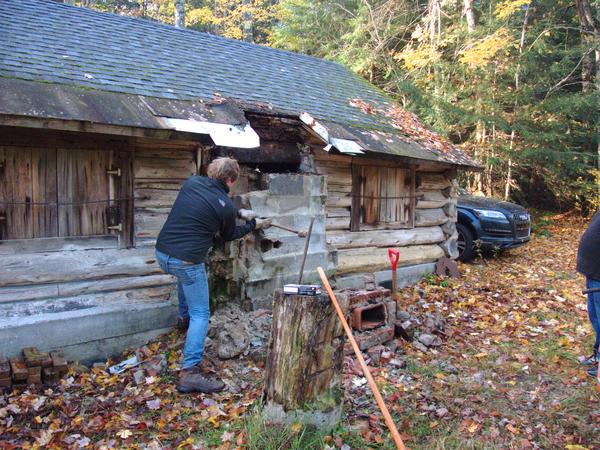 Bill working on demolishing the rest of the chimney.