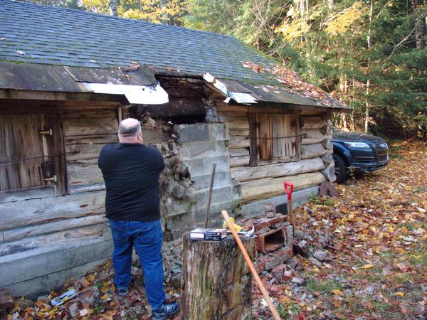 Jon working on demolishing the rest of the chimney.