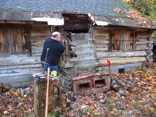 Jon working on demolishing the rest of the chimney.