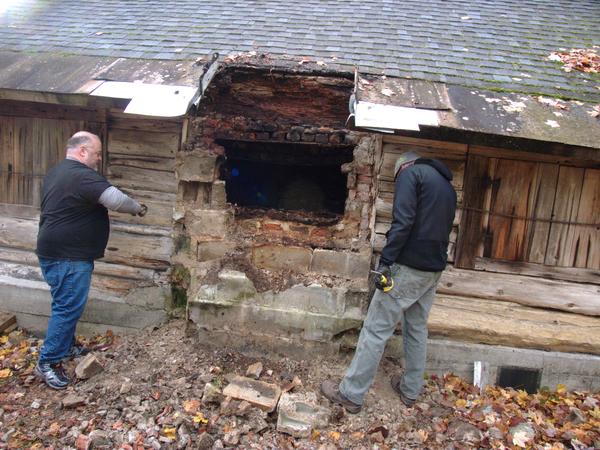 Jon and Andy preparing to remove more cinder blocks.