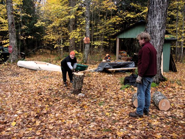 Jon splitting some hard, wet maple with Bill supervising.