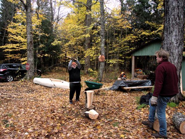 Jon splitting some hard, wet maple with Bill supervising.