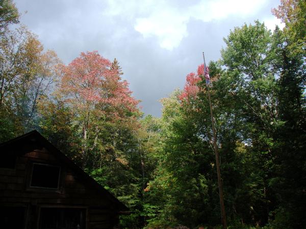 Leaves changing color by the Cabin. The flag pole is often in use.