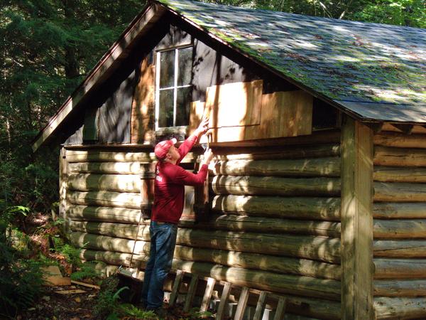 Bill with more work on the cedar shingles.