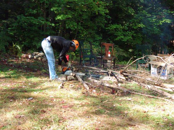 Mikey cutting some wood.