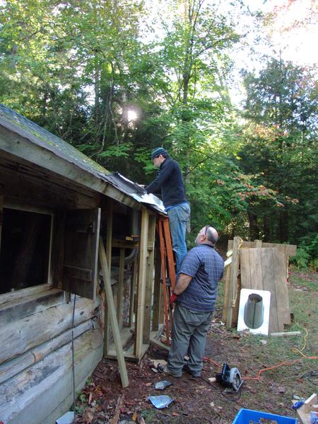 Mikey and Jon preparing to attach the insulated pipes for the smoke stack.