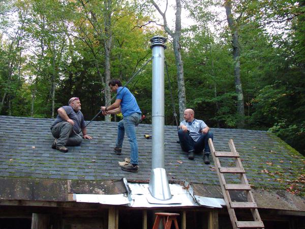 Mikey, Jon, and Jim securing the supports for the new smoke stack.