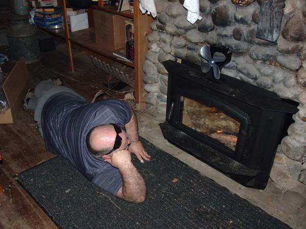 Jon relaxing by the first fire in the fireplace in decades.