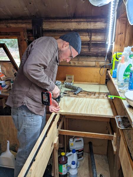 Andy working on replacing the countertop.