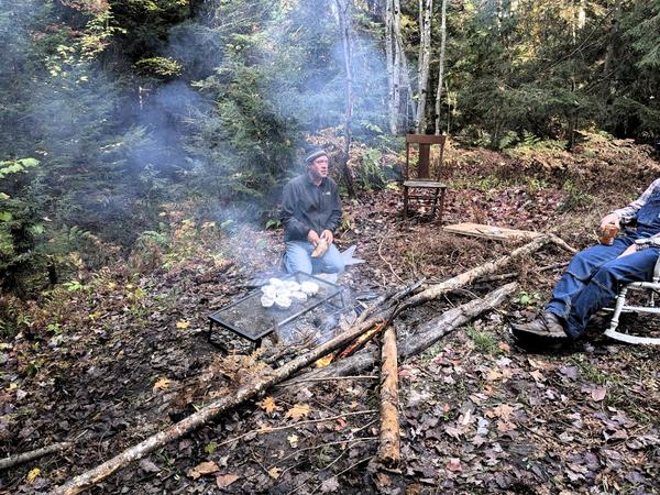 Bill cooking summer squash over the fire.