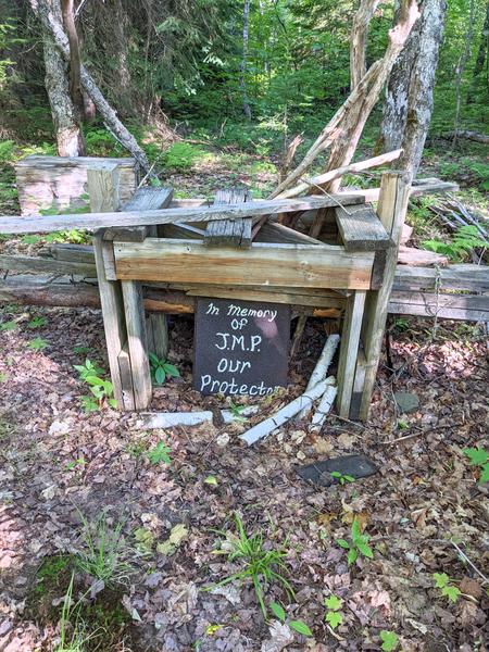 Memorial near new bridge off Old Seney near former ruined cabin.