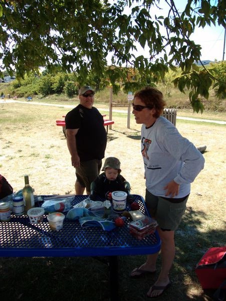 Jon, Amelia, and Teddy at a picnic in Grand Marais harbor.