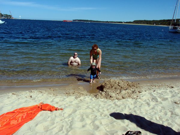 Jon, Amelia, and Teddy playing in Lake Superior in Grand Marais harbor.