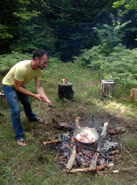 Jordan making paella over the fire.