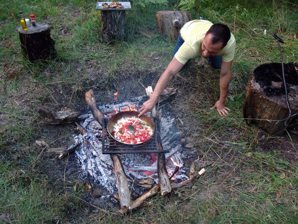 Jordan stirring the paella without getting burned.