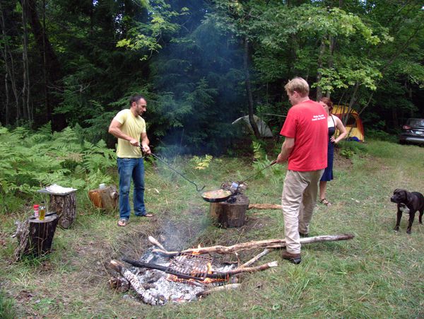 Jordan and Bill removing the finished paella.