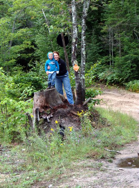 Frankie and Vittoria at the large stump along McCloud Grade.