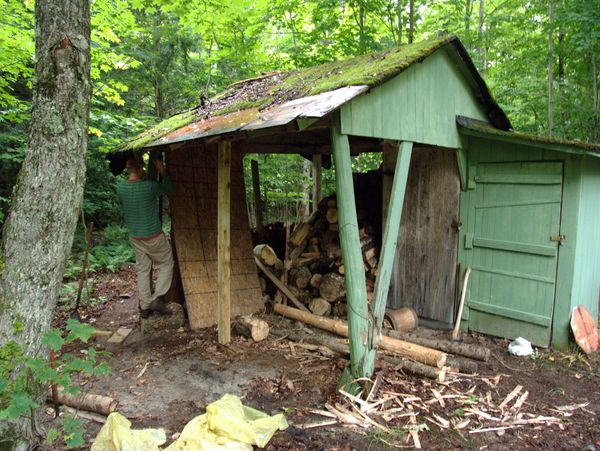 Bill working on bracing a corner of the wood shed.