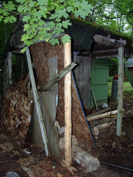 Temporary support for the wood shed in place.