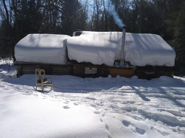 The Cabin on a beautiful day. I pulled out the rocking chair to do a little reading in the sun.